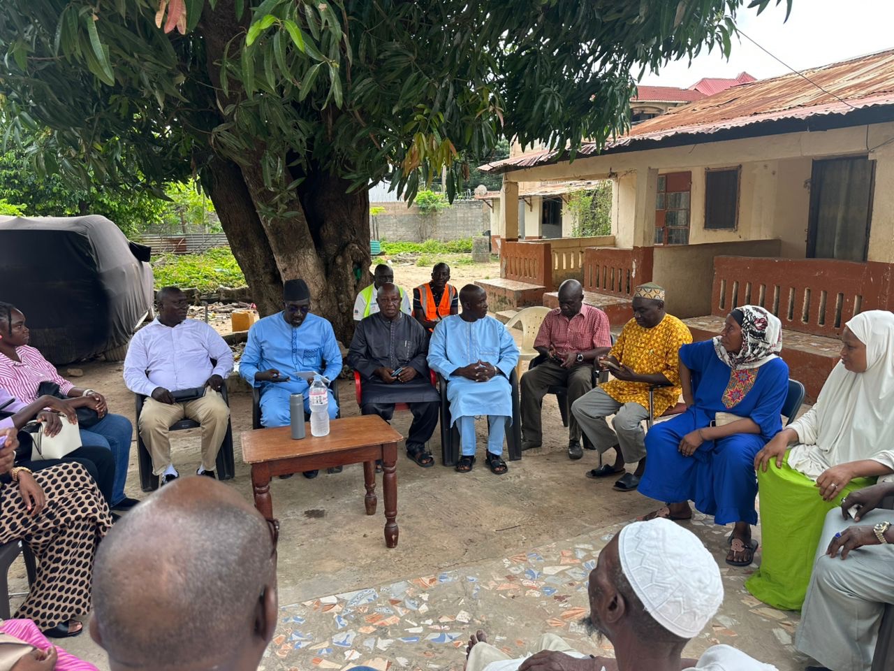 Community discussion during project sensitization session in Tallinding