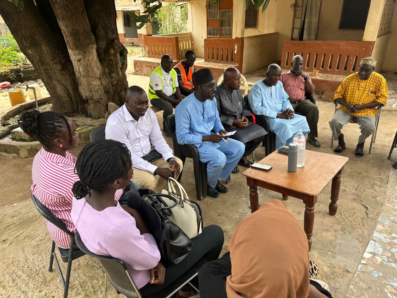 Community discussion during project sensitization session in Bundung