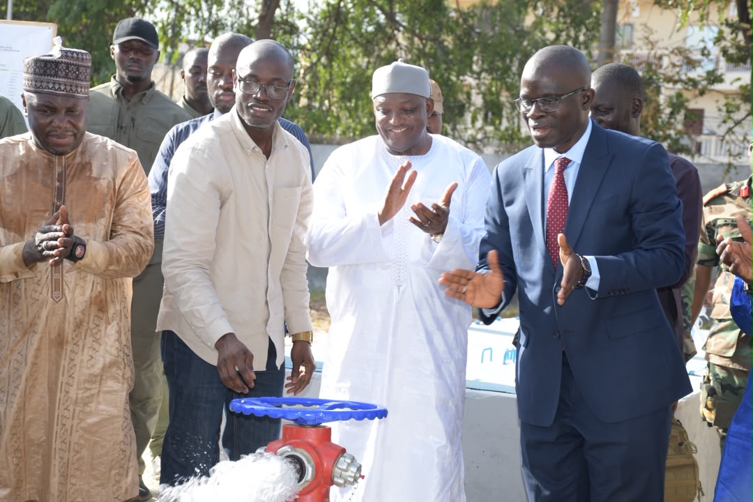 President Barrow and Minister Nani Juwara activate the water hydrant — 19 October 2026