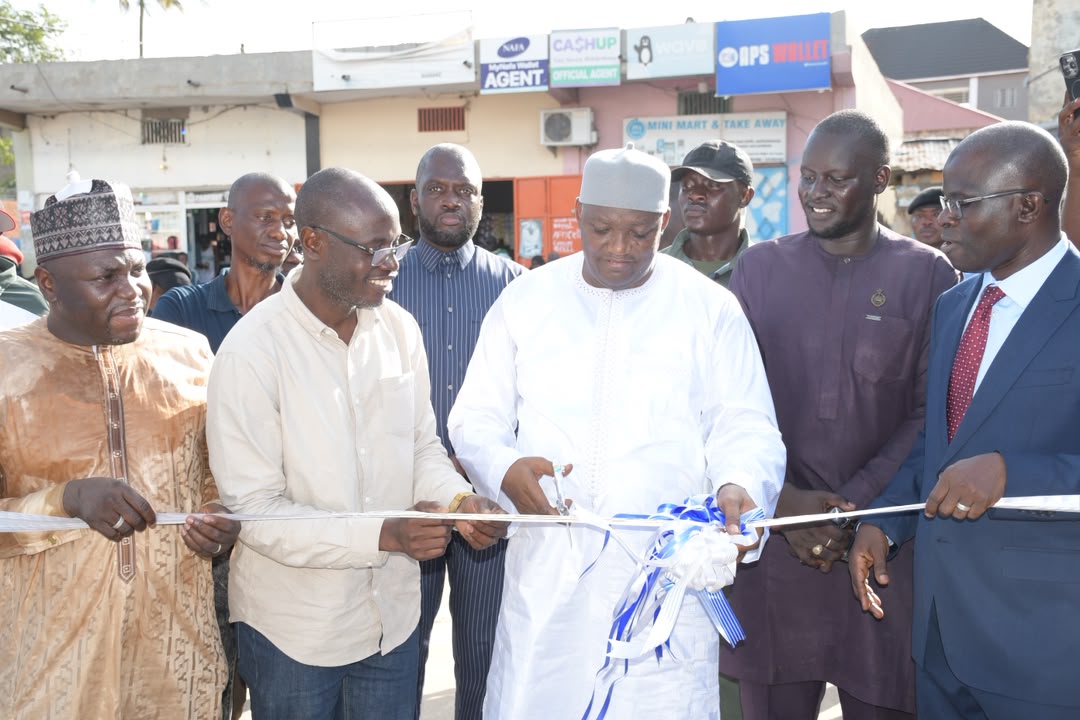 H.E. President Adama Barrow cuts the ceremonial ribbon in the presence of Honourable Minister Nani Juwara and Omar Sanneh, Head of Water NAWEC — Banjul Albion Water Storage Tank inauguration, 19 October 2026